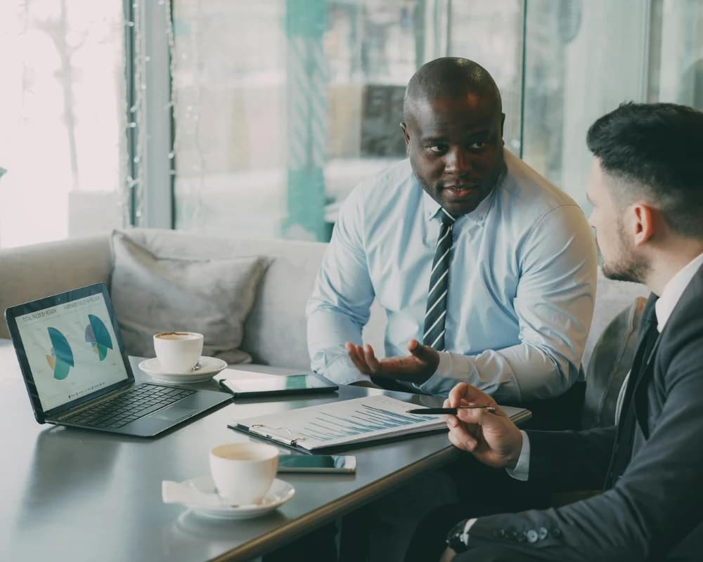 Business professionals reviewing reports and analytics through a B2B web portal.